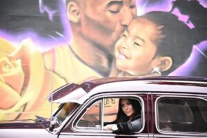 PHOTO Mural Of Vanessa Bryant Driving In A Chevy With Window Rolled Down Past Kobe And Gigi On 1361 S Main St In Los Angeles