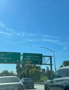 PHOTO Someone Had A Banner Flying Above Traffic In LA Saying Unmask Our Kids But It Was Upside Down