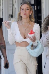 PHOTO Sydney Sweeney Smirking While Eating Strawberry Italian Ice In LA Because She Knows She's Hot