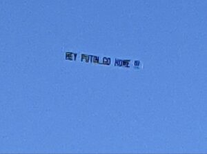 PHOTO Hey Putin Go Home Banner Flying Over Newport Beach California