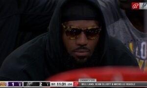 PHOTO Lebron Wearing $1000 Cheetah Sunglasses On Bench Dressed Like Agent Zero