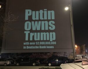 PHOTO Sign In Oakland California That Says Putin Owns Trump With Over $2 Million In Deutsche Bank Loans