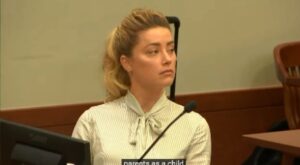 PHOTO Amber Heard In The Court Room Looking Like She's Going To Get Away With Murder From Massive Smirk On Her Face