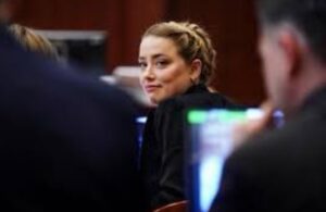 PHOTO Amber Heard Looking Back At Johnny With A Huge Grin Like The Abuser She Is