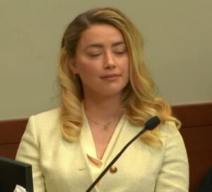 PHOTO Amber Heard Making Delightful Facial Expression As Withholding His Medication From him Is Discussed In Court