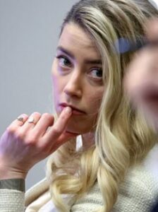 PHOTO Amber Heard Putting Her Finger On Her Lip During Johnny Depp Trial To Look Cute For The Jury