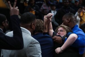 PHOTO Chain Girl Fist Pumping While Getting Carried Off Court In Memphis