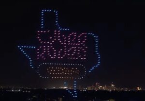 PHOTO Cyber Rodeo Giga Texas Logo Projected In The Sky In Austin TX