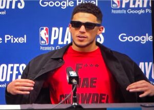 PHOTO Devin Booker Wearing A F*ck Jae Crowder T-Shirt Under His Suit Jacket Post-Game