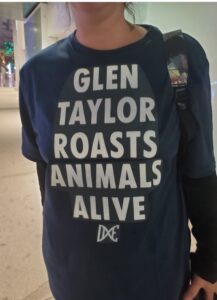 PHOTO Glue Girl Outside Target Center Talking To People About How Glen Taylor Recently Killed 5 Million Chickens