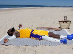 PHOTO Lebron James Passed Out On The Bench In Cancun After Lakers Miss Playoffs