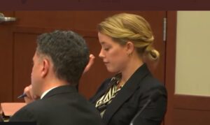 PHOTO Look At The Expression Amber Heard Made While Court Brings Up Her Her Texting Johnny In 2018 To Say She Misses Him And Wishing Him A Happy Birthday