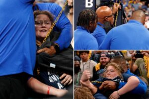 PHOTO Look How Happy Chain Girl Was To Finally Get Attention From Men While Getting Carried Out Of FedEx Forum