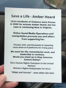 PHOTO Of Flyers Supporting Amber Heard Are Being Given Out To People Outside Courthouse In Virginia Where Johnny Depp Trial Is Taking Place