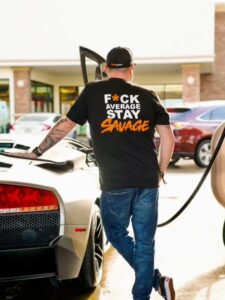 PHOTO Randy Tillim Filling Up His Exotic Car With Gas While Wearing A Fck Average Stay Savage T-Shirt