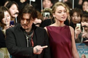 PHOTO Amber Heard Staring Down Johnny Like A True Abuser During An Event In Front Of A Crowd Of People