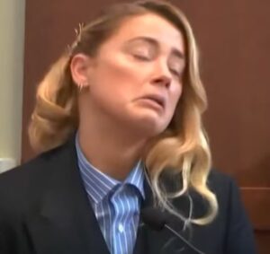 PHOTO Amber Heard Throwing Her Neck Back Pretending Like She Was In Pain Inside Courtroom