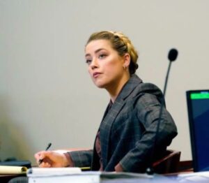 PHOTO Amber Heard Watching Gone Girl And Taking Notes On Evil Tricks Meme