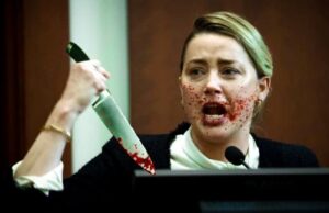 PHOTO Amber Heard With A Butcher Knife With Blood On It And Blood All Over Her Face While On The Stand Meme