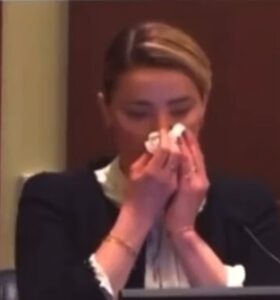 PHOTO Close Up Of Amber Heard Pretending She Has Tears To Wipe Away With A Tissue