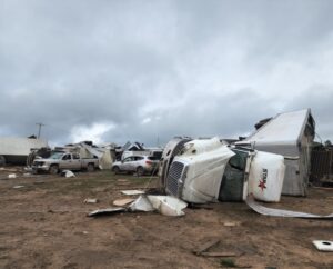 PHOTO Dozens Of Cars Trucks RV's And Semi-Trucks Smashed Beyond Repair Laying All Over In Gaylord Michigan