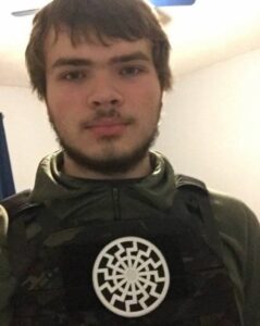 PHOTO Payton Gendron Wearing Black Sun NAZI Symbol On His Body Armor In His Bedroom