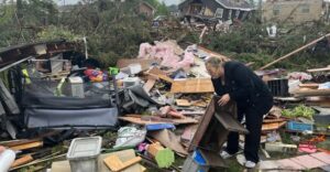 PHOTO Sad Lady Picking Through What Remains Of Her Belongings After Her House Was Leveled By Tornado In Gaylord Michigan