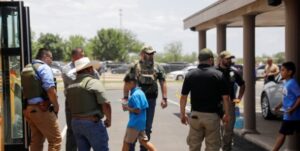 PHOTO Scared Kids At Robb Elementary School Getting On Bus To Leave Elementary Scool