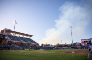 PHOTO Smoke From Fire In Albuquerque Seen From Minor League Baseball Stadium In Town