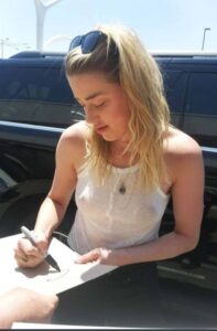 PHOTO Amber Heard Signing Autographs In The Desert For Fans Despite Losing Johnny Depp Trial
