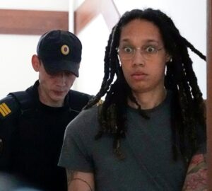 PHOTO Brittney Griner's Eyes Popping Out Of Her Head Like She's Going Insane While Being Transported Around Russian Prison