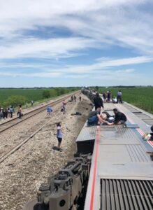 PHOTO People Standing On Train Tracks In Missouri After Amtrak Collides With Dump Truck