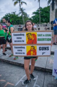 PHOTO Expanding Easy Access To Safe And Illegal Abortions Vs Expanding Easy Access To Guns Ron DeSantis Sign Meme