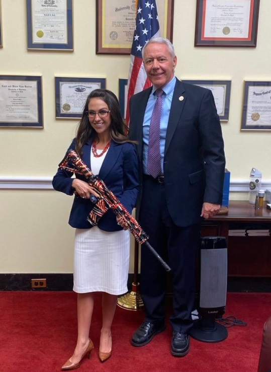 PHOTO Lauren Boebert Holding Ken Buck's Flag Rifle In His Office