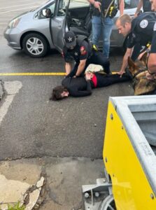 PHOTO Of Robert Crimo Not Resisting Police While Getting Handcuffed And Law Enforcement Officer Pointing Long Gun At His Legs