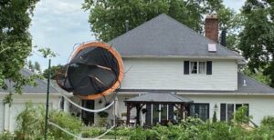 PHOTO Resident In Troy Ohio Had Trampoline Fly Up To The Roof Of Their House In Backyard From Tornado