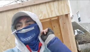 PHOTO Robert Crimo Wearing Wintrust Face Scar While Building Tiny Wooden Home In Parents Backyard