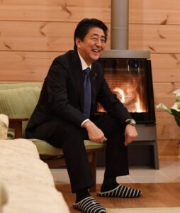 PHOTO Shinzo Abe Wearing Black And White Slippers Inside By The Fireplace