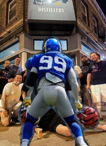 PHOTO Aaron Donald In Front Of The Distillery With Two Bengals Helmets