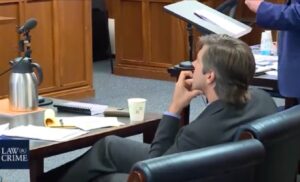 PHOTO Alex Jones' Lawyer Who Leaked His Whole Phone Sitting Motionless Trying To Look Like The Thinker In Court