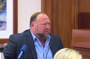 PHOTO Alex Jones' Reaction After Prosecuting Attorney Informed Him His Lawyer Sent 2 Years Of Phone And Email Records Which Prove He Commited Perjury