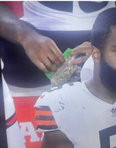 PHOTO Cleveland Browns Player Sitting On Gatorade Cooler With Ziploc Bags Full Of Weed