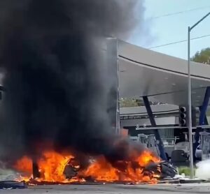 PHOTO Close Up Of Flames Burning On The Ground In Windsor Hills After Crash