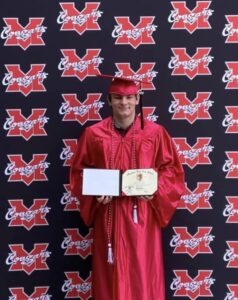 PHOTO Ethan Miller Holding His High School Diploma