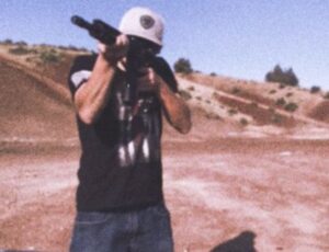 PHOTO Ethan Miller Practicing Shooting Long Gun In Wide Open Field