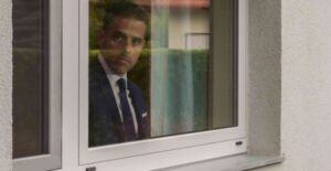 PHOTO Hunter Biden Looking Outside His Window Hoping The FBI Doesn't Stop At His House Too