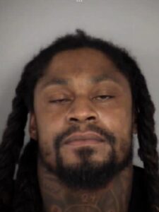 PHOTO Marshawn Lynch Mugshot From Las Vegas Police Has Him Looking Like He Hasn't Sleep In Multiple Days