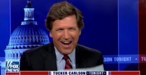 PHOTO Tucker Carlson Giggling On Fox News Like A Little Boy At Liz Cheney's Double-Digit Election Defeat