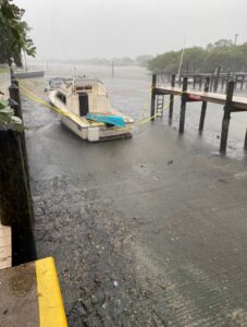 PHOTO Boat Just Sitting In Mud Now After Water Sucked Out Marina In Fort Myers