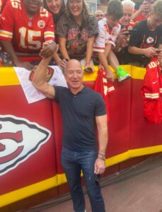 PHOTO Jeff Bezos In Tight Button Up Shirt Shaking Hands With Chiefs Fans Down On The Field